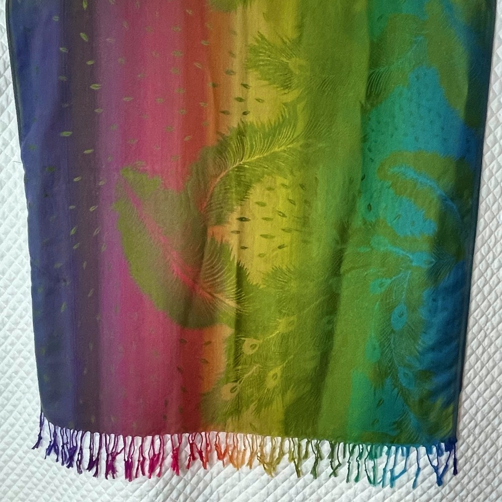 Vibrant rainbow feather design pashmina poncho. Radiance for all seasons! New